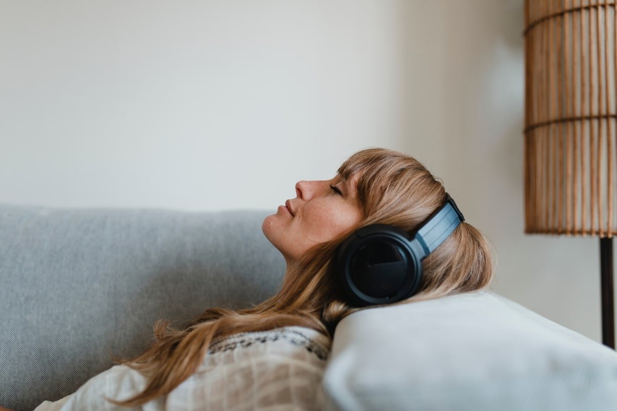 sound therapy woman listening to headphones