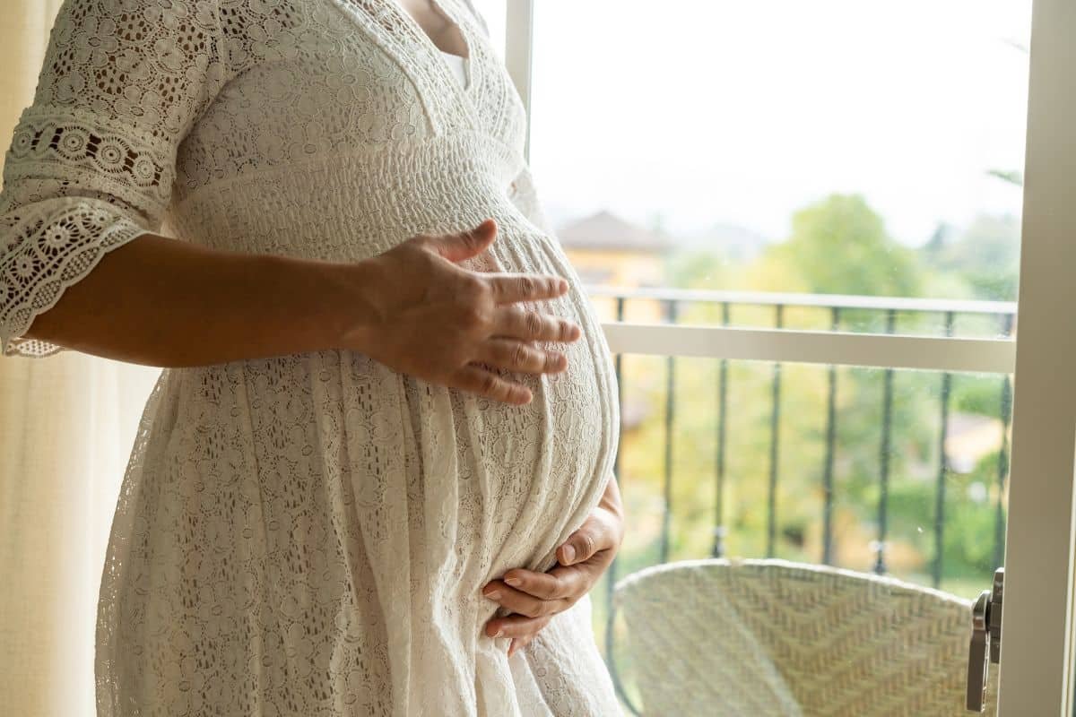 woman holding pregnant belly